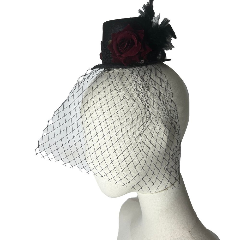 Tiny black satin hair top hat with net and red flower